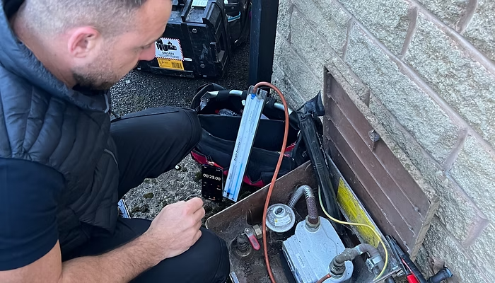 Ecoflows engineer carrying out outdoor heating work