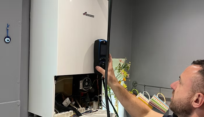 Ecoflows engineer working on a boiler installation